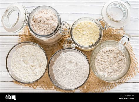 Different flour jars, wheat, corn, rye, oats, spelt, flax