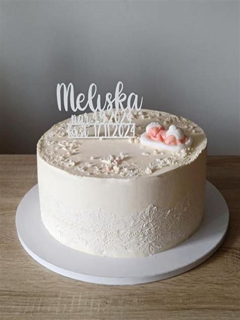 Torta s anjelikom a kvetmi na krstiny